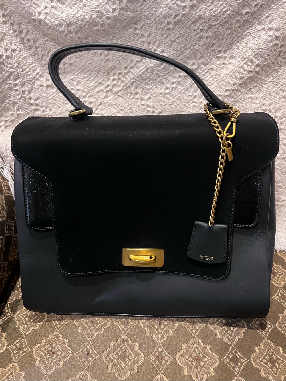 Tumi Black Leather Top-Handle Satchel with Gold Hardware and Chain